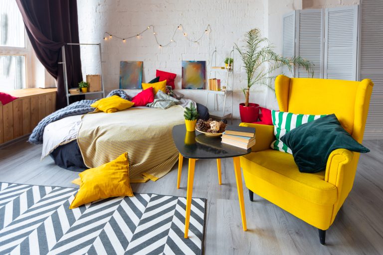 trendy fashion luxury interior design scandinavian style studio apartment with bright yellow furniture decorated with lights